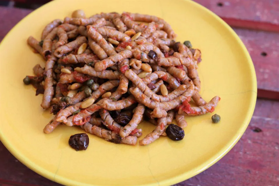 Busiate pasta with a chunky sauce.