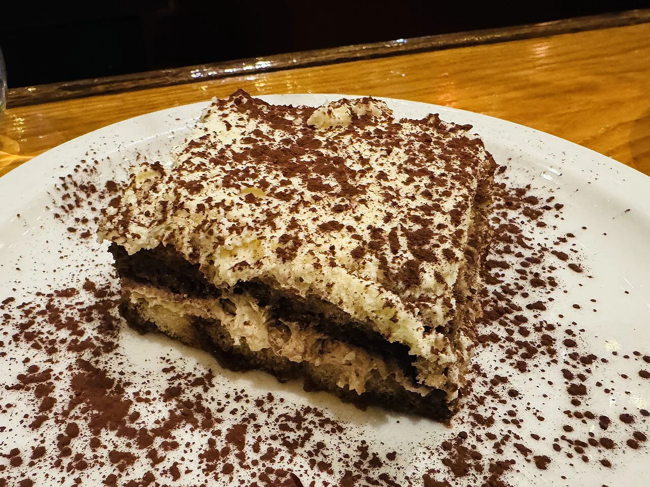 Slice of tiramisu on a plate.
