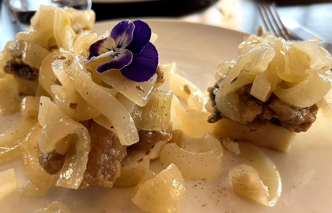 Sarde in saor served with onions.